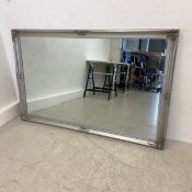 A contemporary wall mirror with bevelled plate. H.103 W.165cm