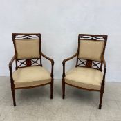 A pair of Edwardian mahogany and satinwood armchairs with olivewood and boxwood marquetry inlaid