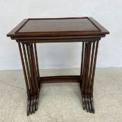 A nest of four 19th century mahogany graduating occasional tables on turned stretchered supports.