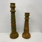 Two carved painted polychrome candlesticks. H.61cm