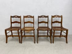 A matched set of four 19th century oak framed bedroom chairs on sabre supports. H.79cm
