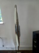 A contemporary Coltrane full height floor lamp by DelightFULL having a polished chrome shade on