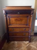 A 19th century North European carved walnut escritoire with frieze drawer above fitted secretaire