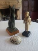 Three moulded Egyptian figures, Bastet, a Pharoe figure and scarab beetle. H.31cm (cat with damage