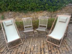A pair of teak folding garden chairs and a pair of deck chairs.