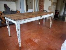 A 19th century pine farmhouse table having a rectangular plank top over a small single frieze drawer