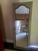 A 19th century French dressing mirror having a shaped plate in a painted frame. 180x66cm
