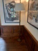 A floor standing standard lamp with metal reeded column and lacquered metal shade. H.182cm.