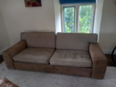A contemporary three seater sofa having a square taupe chenille upholstered back and seat with