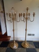 A pair of floor standing metal five branch candelabras. H.123cm