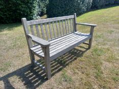 A contemporary teak slatted garden bench with maker's plaque. W.160cm