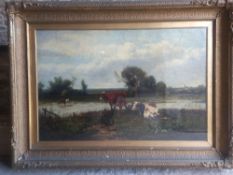 A 19th century oil on canvas country landscape with cows by a river, glazed and gilt framed.