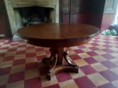 A 19th century mahogany Biedermeier centre on scrolling platform pedestal support. H.75 Dia 124cm