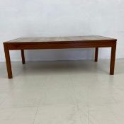 A mid-century teak coffee table with inset ceramic tile top. H.43 W.127 D.66cm