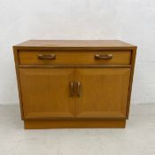 A mid-century teak G-Plan side cabinet with maker's label. H.69 W.84 D.46cm