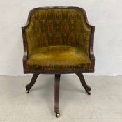 An Edwardian mahogany and satinwood strung tub shaped desk chair with swivel action on quadruped