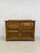 A mid-century oak Jacobean style sideboard. 87x122x48cm