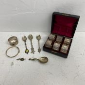 A cased set of six 19th century silver plated napkin rings, a hallmarked silver napkin ring and
