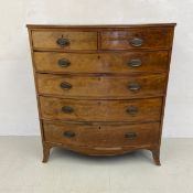 A Georgian mahogany bow fronted chest of two short over four long graduating drawers with a shaped