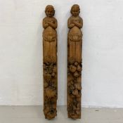 A pair of oak carved pilasters with caryatid supports and fruit decoration. H.83cm each