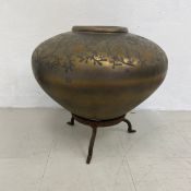 A large Eastern style simulated bronze ceramic vessel or bowl hand painted with scrolling foliate
