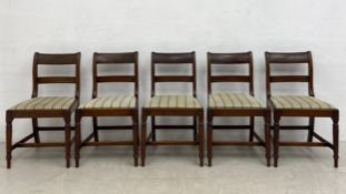 A set of five Georgian mahogany bar-back dining chairs each having a square back and splat over a