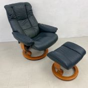 An Ekornes 'Stressless' armchair and the matching footstool.