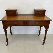 A 19th century walnut writing or dressing table with frieze drawers on turned tapering supports. H.