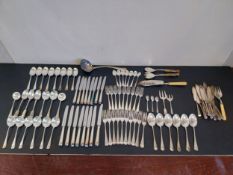 A mixed collection of silver plated forks, spoons and knives to include twenty-five fish knives by