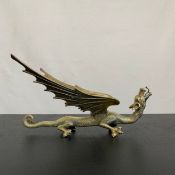 A 20th century Oriental style brass dragon figure. L.33cm (tail to end of face)
