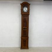 A late 19th century French carved walnut comtoise longcase clock with pendulum and weights. H.