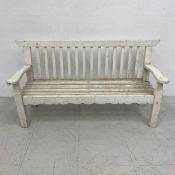 A vintage distressed painted child's garden bench. H.54 W.98 D.34cm