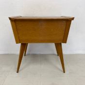 A mid-century teak Vereston sewing table on splayed supports. H.51 W.50 D.38cm