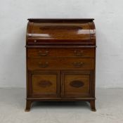 A 19th century mahogany and satinwood crossbanded cylinder bureau with roll top revealing fitted