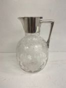 An early 20th century etched glass and silver plated claret jug. H.20cm plated