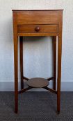 A 19th century mahogany urn stand or lamp table with square top over single frieze drawer raised