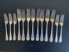 A set of eight English hallmarked silver dinner forks and five matching dessert forks, Francis