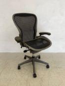 A contemporary ergonomic office or desk chair in the style of Herman Miller. H.115cm