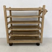 A vintage linen trolley with maker's label; Lockhart of Reading. H.101.5 W.102.5 D.46cm