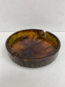 A large mid century Italian ceramic ashtray with drip or lava style polychrome glaze by Franco