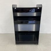 A vintage Habitat style black moulded plastic shelving unit or office cabinet on castors. H.71