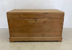 A large late 19th century pine chest with simulated pitch pine interior, twin carrying handles and