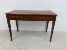A late 19th century walnut side or writing table with rectangular top over two frieze drawers with