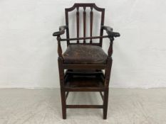 A Georgian mahogany child's armchair with stand converting to a high chair. H.91cm