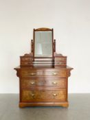 A 19th century burr walnut dressing table having a superstructure with four drawers and swing mirror