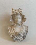 A carved marble bust, portrait of a young lady, signed Duval to the reverse. H.27cm