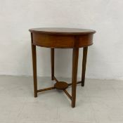 An Edwardian mahogany and satinwood strung occasional table. Dia.61 H.65cm. (Reduced in height)