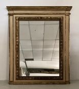 A large 19th century floor or overmantle mirror having a moulded breakfront cornice over a matched