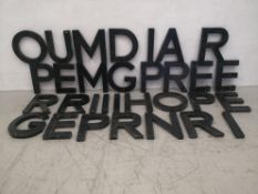 A set of thrity-one painted sheet metal letters, possibly from a shop sign. H.30cm