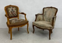 A 19th century French walnut framed fauteuil armchair with floral needlework upholstery along with a